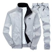 Heren oversized joggingpak set met rits, opstaande kraag en lange broek. Gemaakt van katoen-polyester mix voor comfort en warmte in de herfst en winter.