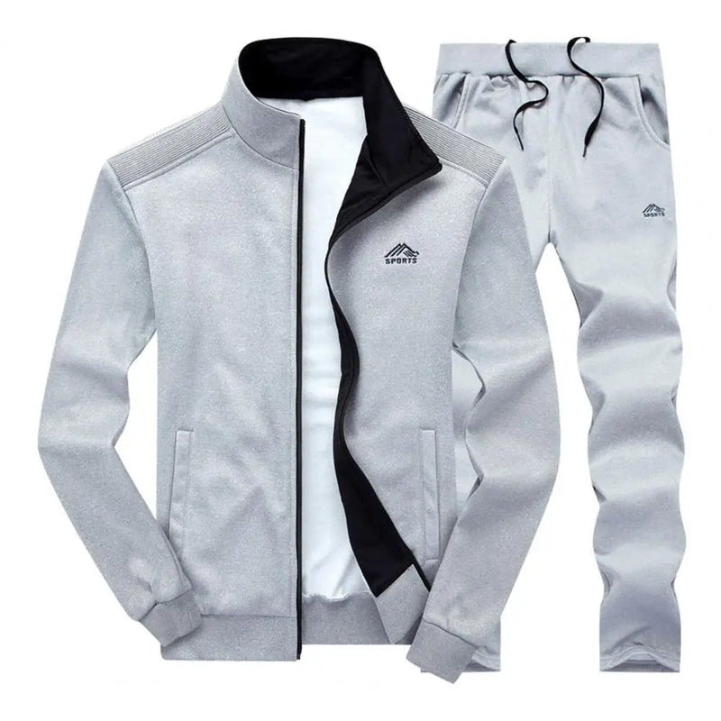Heren oversized joggingpak set met rits, opstaande kraag en lange broek. Gemaakt van katoen-polyester mix voor comfort en warmte in de herfst en winter.